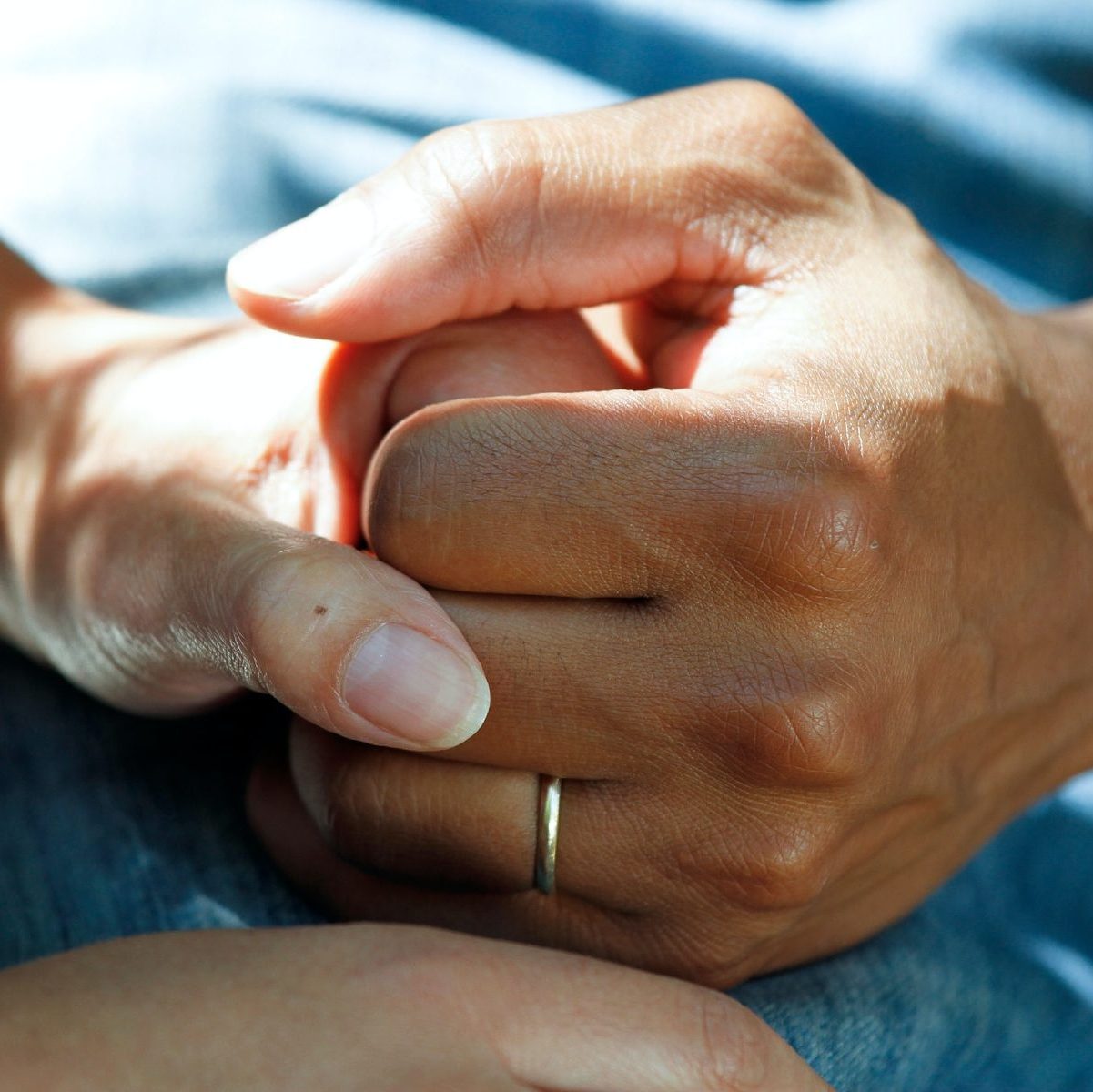 person wearing gold wedding band